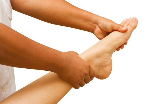 a physio therapist  test the foot and ankle