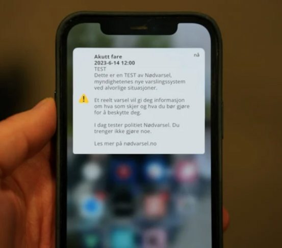 Bilde av mobiltelefon med varsel på