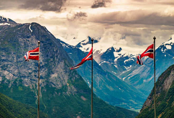 Norwegian flags and mountains landscape
